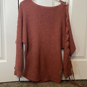 Ardene knitted sweater, size large fits accurately.